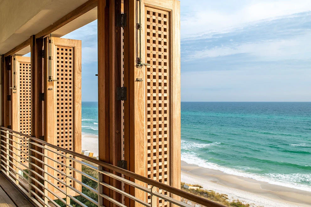 Gulf-Front Grandeur – Exterior Balcony View with Custom Shutters exterior balcony view with custom shutters Gulf-Front Grandeur