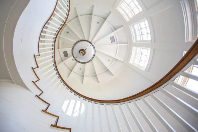 In Surf We Trust – Interior Spiral Staircase Upward e f san juan, interior spiral staircase upward In Surf We Trust, exposed painted ceiling joists, coastal decor, seaside florida, 30A, south walton, walton county, northwest florida