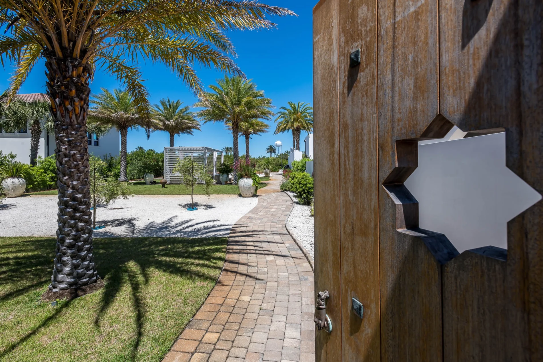 Florida Garden Gate – E. F. San Juan Wooden garden gate with star cut-out design by E. F. San Juan