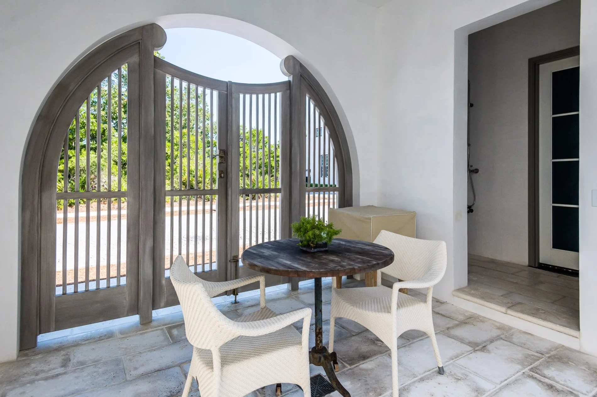 Arched Wooden Courtyard Gate – E. F. San Juan Alys Beach pool deck arched entry gate by E. F. San Juan