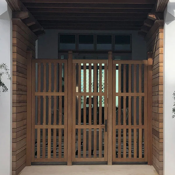E. F. San Juan – Custom Gates, Shutters, Paneling Wooden gate leading to Alys Beach courtyard in Florida, crafted by E. F. San Juan
