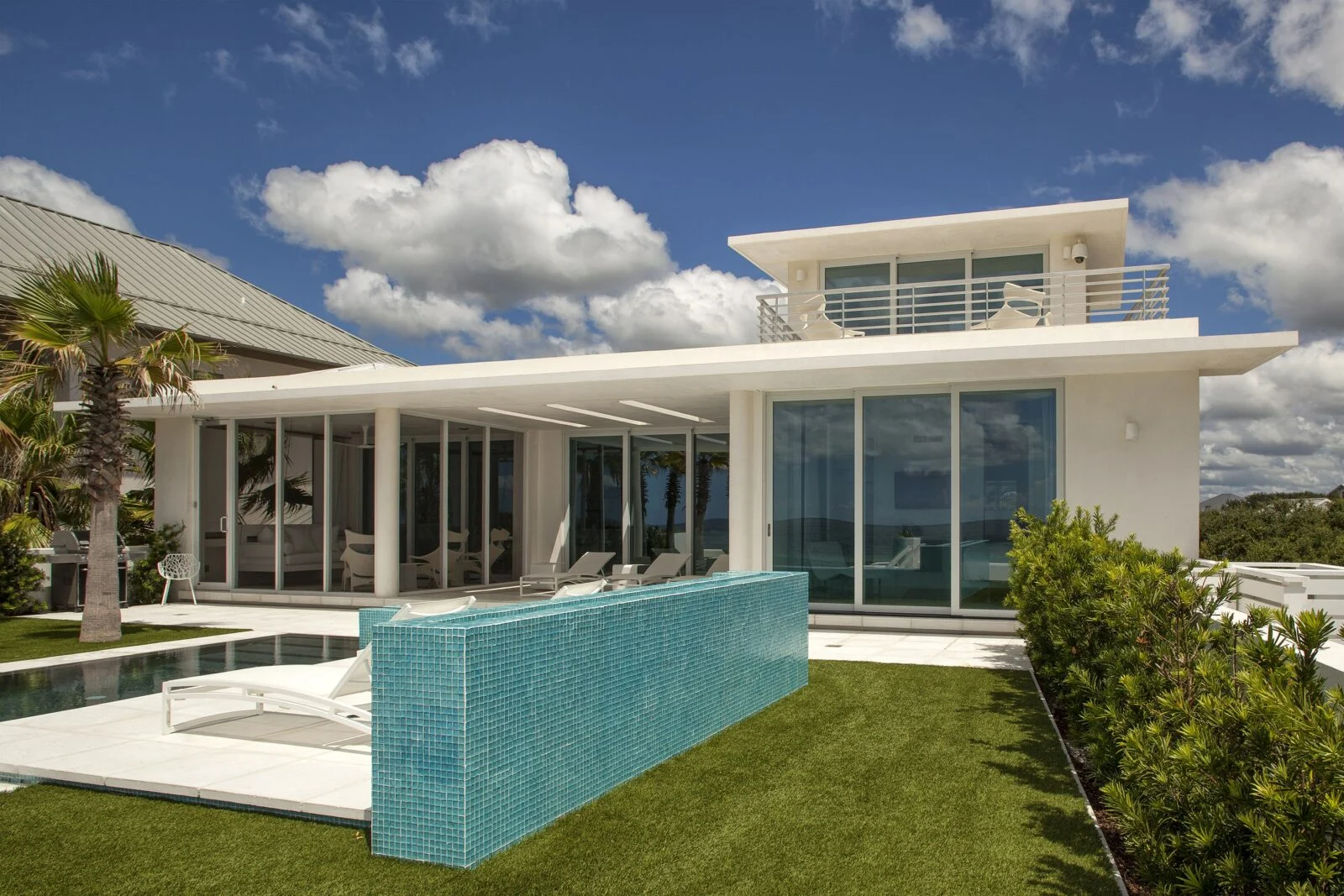 Loewen Windows & Doors in Camp Creek, Exterior View – E. F. San Juan Backyard exterior view of Gulf-front home in Santa Rosa Beach, Florida, with Loewen Windows and Doors by E. F. San Juan