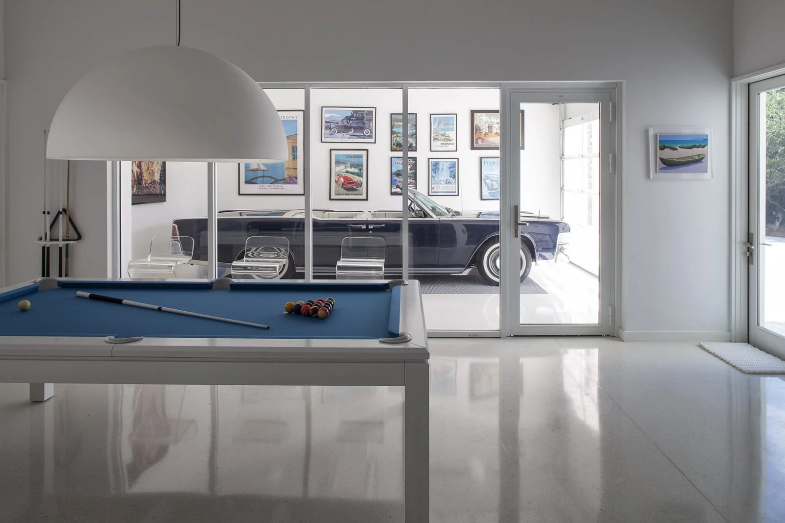 Interior Windows Looking into Custom Garage Area Unique interior windows looking into the garage and vintage car of home in Santa Rosa Beach, Florida