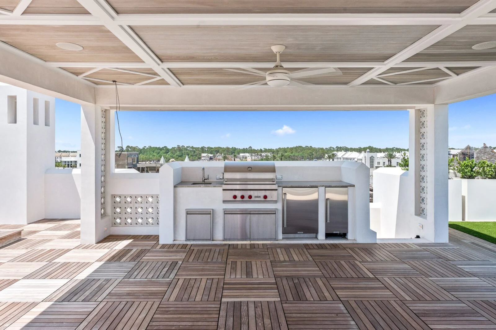 Old Cellar Lane Covered Deck – Alys Beach Millwork by E. F. San Juan Covered outdoor kitchen on Alys Beach rooftop with custom decking by E. F. San Juan