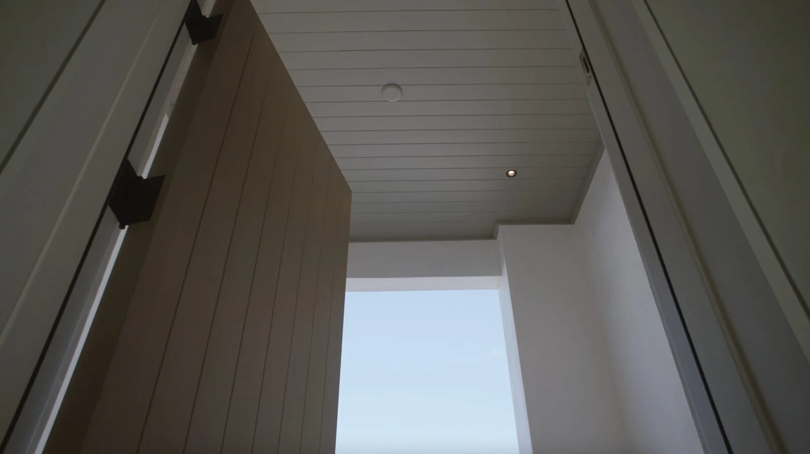 Modern Home on North Shore Island Panama City – Front Door Custom wooden Invincia impact-rated door by E. F. San Juan in Panama City, Florida