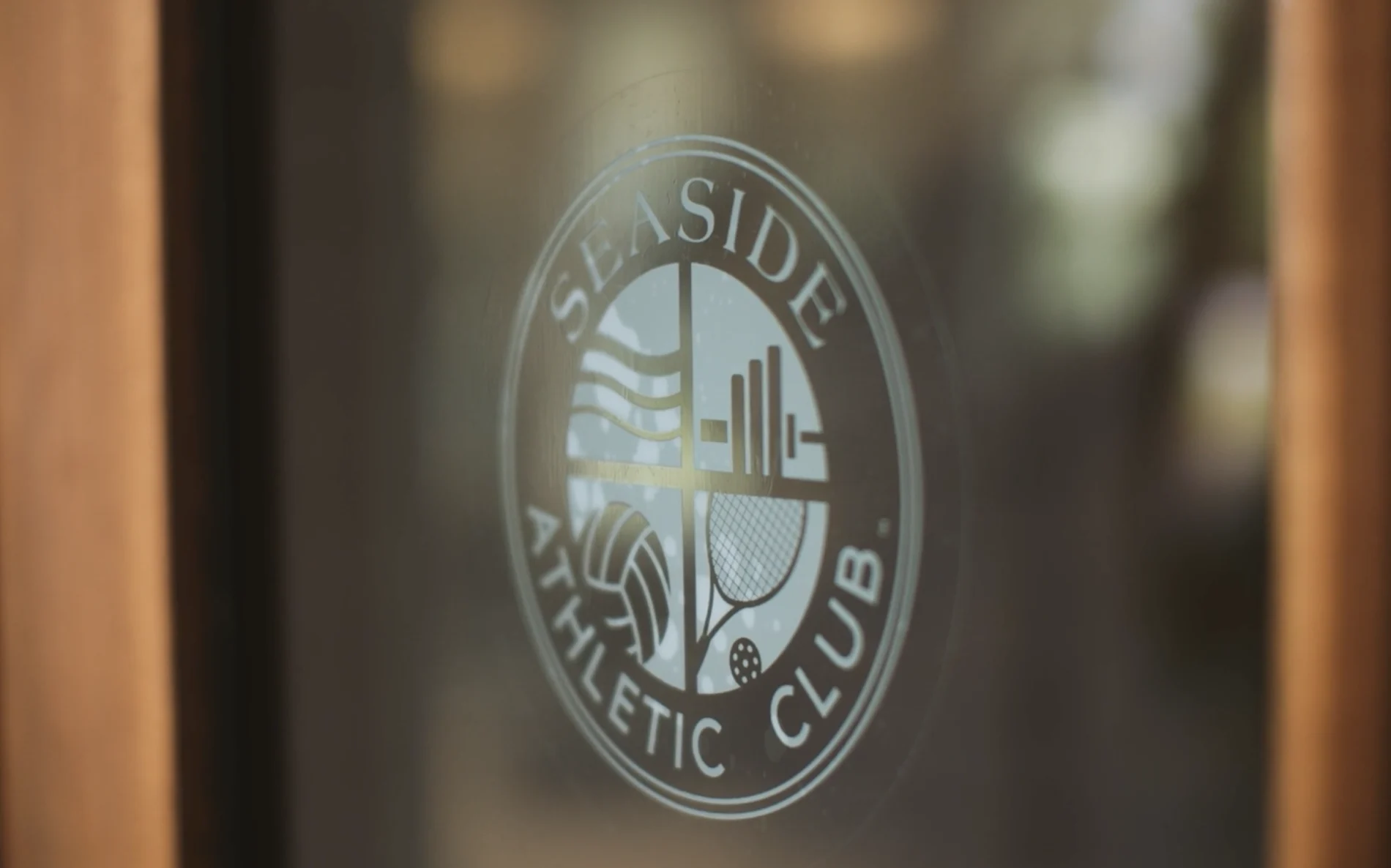 Seaside, Florida, Athletic Club Entrance Logo on the door of Seaside Athletic Club fitness center built in 2026 in Seaside, Florida